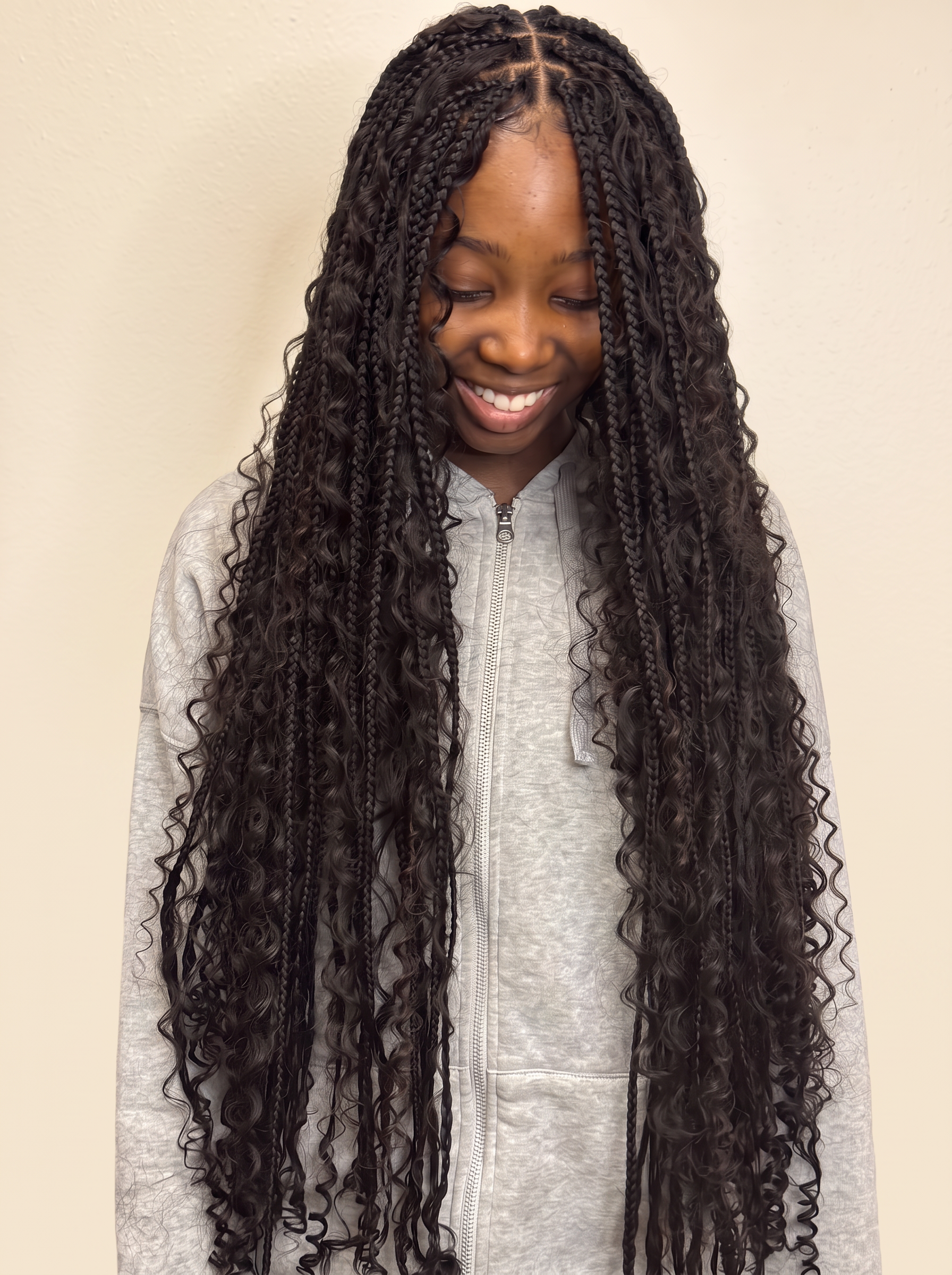 Long boho knotless braids with loose curls